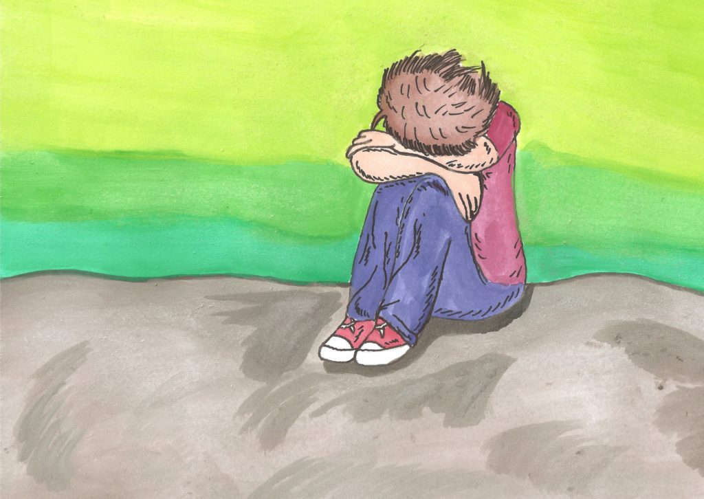 Obrazek to grafika malowana farbami przedstawiająca siedzącego chłopca z pochyloną głową i twarzą ukrytą w skrzyżowanych na kolanach ramionach. Tło w dolej połowie obrazka brązowe, a w górnej zielone.